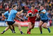 14 June 2025; Shane McGuigan of Derry in action against Dublin players, from left, Sean Bugler and Brian Howard during the GAA Football All-Ireland Senior Championship Round 3 match between Dublin and Derry at Páirc Esler in Newry, Down. Photo by Thomas Flinkow/Sportsfile