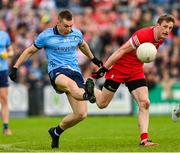 14 June 2025; Con O'Callaghan of Dublin in action against Brendan Rogers of Derry during the GAA Football All-Ireland Senior Championship Round 3 match between Dublin and Derry at Páirc Esler in Newry, Down. Photo by Ramsey Cardy/Sportsfile