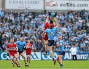 14 June 2025; Dan Higgins of Derry and Peadar Ó Cofaigh Byrne of Dublin compete for the high ball during the GAA Football All-Ireland Senior Championship Round 3 match between Dublin and Derry at Páirc Esler in Newry, Down. Photo by Thomas Flinkow/Sportsfile