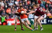 14 June 2025; Jason Duffy of Armagh is tackled by Dylan McHugh, left, and Peter Cooke of Galway during the GAA Football All-Ireland Senior Championship Round 3 match between Galway and Armagh at Kingspan Breffni in Cavan. Photo by Ben McShane/Sportsfile