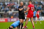 14 June 2025; Referee Brendan Cawley speaks to Ciaran McFaul of Derry after an incident with Lee Gannon of Dublin, below, during the GAA Football All-Ireland Senior Championship Round 3 match between Dublin and Derry at Páirc Esler in Newry, Down. Photo by Ramsey Cardy/Sportsfile