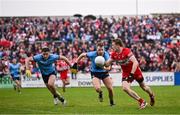 14 June 2025; Brendan Rogers of Derry in action against Cormac Costello, left, and Sean Bugler of Dublin during the GAA Football All-Ireland Senior Championship Round 3 match between Dublin and Derry at Páirc Esler in Newry, Down. Photo by Ramsey Cardy/Sportsfile
