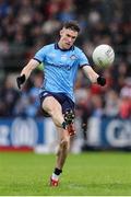14 June 2025; Lee Gannon of Dublin attempts a shot during the GAA Football All-Ireland Senior Championship Round 3 match between Dublin and Derry at Páirc Esler in Newry, Down. Photo by Thomas Flinkow/Sportsfile