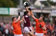 14 June 2025; Shane Walsh of Galway is tackled by Peter McGrane, left, and Rian O'Neill of Armagh during the GAA Football All-Ireland Senior Championship Round 3 match between Galway and Armagh at Kingspan Breffni in Cavan. Photo by Ben McShane/Sportsfile