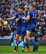 14 June 2025; Jordie Barrett of Leinster, left, celebrates with teammates Tommy O'Brien, centre, and Sam Prendergast after scoring their side's second try during the United Rugby Championship Grand Final match between Leinster and Vodacom Bulls at Croke Park in Dublin. Photo by Brendan Moran/Sportsfile