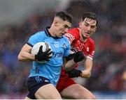 14 June 2025; Lee Gannon of Dublin in action against Paul Cassidy of Derry during the GAA Football All-Ireland Senior Championship Round 3 match between Dublin and Derry at Páirc Esler in Newry, Down. Photo by Thomas Flinkow/Sportsfile