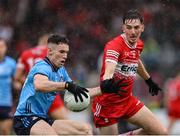 14 June 2025; Lee Gannon of Dublin in action against Paul Cassidy of Derry during the GAA Football All-Ireland Senior Championship Round 3 match between Dublin and Derry at Páirc Esler in Newry, Down. Photo by Thomas Flinkow/Sportsfile