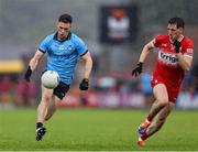 14 June 2025; Lee Gannon of Dublin in action against Paul Cassidy of Derry during the GAA Football All-Ireland Senior Championship Round 3 match between Dublin and Derry at Páirc Esler in Newry, Down. Photo by Thomas Flinkow/Sportsfile