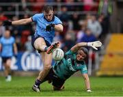 14 June 2025; Sean Bugler of Dublin in action against Derry goalkeeper Ben McKinless during the GAA Football All-Ireland Senior Championship Round 3 match between Dublin and Derry at Páirc Esler in Newry, Down. Photo by Thomas Flinkow/Sportsfile