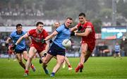 14 June 2025; Ciaran Kilkenny of Dublin in action against Lachlan Murray, left, and Shane McGuigan of Derry during the GAA Football All-Ireland Senior Championship Round 3 match between Dublin and Derry at Páirc Esler in Newry, Down. Photo by Ramsey Cardy/Sportsfile
