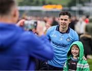 14 June 2025; David Byrne of Dublin has his photo taken with a supporter after the GAA Football All-Ireland Senior Championship Round 3 match between Dublin and Derry at Páirc Esler in Newry, Down. Photo by Thomas Flinkow/Sportsfile