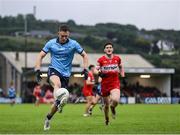 14 June 2025; Tom Lahiff of Dublin in action against Padraig McGrogan of Derry during the GAA Football All-Ireland Senior Championship Round 3 match between Dublin and Derry at Páirc Esler in Newry, Down. Photo by Thomas Flinkow/Sportsfile