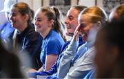 14 June 2025; Emma Kelly, centre, and team-mates during a presentation before a Leinster women's rugby squad training session at Wanderers Rugby Club in Dublin. Photo by Shauna Clinton/Sportsfile