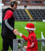 15 June 2025; A young Louth supporter give Conor Grimes of Louth a high five before the GAA Football All-Ireland Senior Championship Round 3 match between Louth and Clare at Laois Hire O'Moore Park in Portlaoise, Laois. Photo by Shauna Clinton/Sportsfile