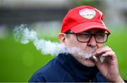 15 June 2025; A Louth supporter enjoys a cigarette before the GAA Football All-Ireland Senior Championship Round 3 match between Louth and Clare at Laois Hire O'Moore Park in Portlaoise, Laois. Photo by Shauna Clinton/Sportsfile