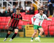 13 June 2025; Evan McLaughlin of Cork City in action against Archie Meekison of Bohemians during the SSE Airtricity Men's Premier Division match between Cork City and Bohemians at Turner's Cross in Cork. Photo by Michael P Ryan/Sportsfile