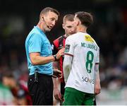 13 June 2025; Referee Paul Norton in conversation with Evan McLaughlin of Cork City during the SSE Airtricity Men's Premier Division match between Cork City and Bohemians at Turner's Cross in Cork. Photo by Michael P Ryan/Sportsfile