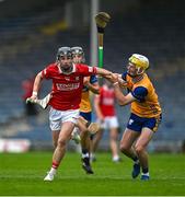 15 June 2025; Cormac Deane of Cork in action against Zak Phelan of Clare during the Electric Ireland GAA Hurling All-Ireland Minor Championship semi-final match between Cork and Clare at FBD Semple Stadium in Thurles, Tipperary. Photo by Brendan Moran/Sportsfile