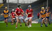 15 June 2025; Cormac Deane of Cork in action against Zak Phelan of Clare during the Electric Ireland GAA Hurling All-Ireland Minor Championship semi-final match between Cork and Clare at FBD Semple Stadium in Thurles, Tipperary. Photo by Brendan Moran/Sportsfile
