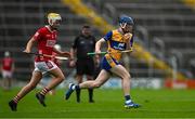 15 June 2025; Evan Cleary of Clare in action against Ryan Dineen of Cork during the Electric Ireland GAA Hurling All-Ireland Minor Championship semi-final match between Cork and Clare at FBD Semple Stadium in Thurles, Tipperary. Photo by Brendan Moran/Sportsfile