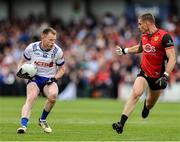 15 June 2025; Ryan McAnespie of Monaghan in action against Pat Havern of Down during the GAA Football All-Ireland Senior Championship Round 3 match between Monaghan and Down at BOX-IT Athletic Grounds in Armagh. Photo by Thomas Flinkow/Sportsfile