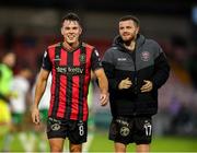 13 June 2025; Bohemians players, from left, Dayle Rooney and Adam McDonnell after their side's victory in the SSE Airtricity Men's Premier Division match between Cork City and Bohemians at Turner's Cross in Cork. Photo by Michael P Ryan/Sportsfile
