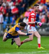 15 June 2025; Ciaran Downey of Louth in action against Cillian Rouine of Clare during the GAA Football All-Ireland Senior Championship Round 3 match between Louth and Clare at Laois Hire O'Moore Park in Portlaoise, Laois. Photo by Shauna Clinton/Sportsfile