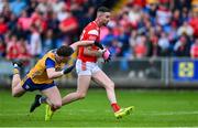 15 June 2025; Ciaran Downey of Louth in action against Cillian Rouine of Clare during the GAA Football All-Ireland Senior Championship Round 3 match between Louth and Clare at Laois Hire O'Moore Park in Portlaoise, Laois. Photo by Shauna Clinton/Sportsfile