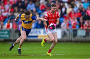 15 June 2025; Ciaran Downey of Louth in action against Cillian Rouine of Clare during the GAA Football All-Ireland Senior Championship Round 3 match between Louth and Clare at Laois Hire O'Moore Park in Portlaoise, Laois. Photo by Shauna Clinton/Sportsfile