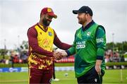 15 June 2025; Ireland captain Paul Stirling, right, and West Indies captain Shai Hope before match three of the T20 International Series between Ireland and the West Indies at Bready Cricket Club in Magheramason, Tyrone. Photo by Ramsey Cardy/Sportsfile