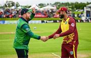 15 June 2025; Ireland captain Paul Stirling, left, and West Indies captain Shai Hope before match three of the T20 International Series between Ireland and the West Indies at Bready Cricket Club in Magheramason, Tyrone. Photo by Ramsey Cardy/Sportsfile