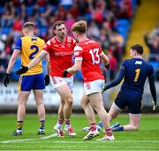 15 June 2025; Sam Mulroy of Louth, left, is congratulated by team-mate Ciaran Keenan after scoring his side's first goal during the GAA Football All-Ireland Senior Championship Round 3 match between Louth and Clare at Laois Hire O'Moore Park in Portlaoise, Laois. Photo by Shauna Clinton/Sportsfile