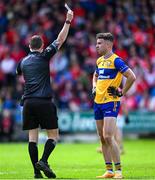 15 June 2025; Referee Barry Tiernan shows Manus Doherty of Clare a yellow card during the GAA Football All-Ireland Senior Championship Round 3 match between Louth and Clare at Laois Hire O'Moore Park in Portlaoise, Laois. Photo by Shauna Clinton/Sportsfile