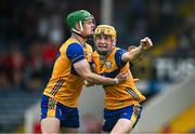 15 June 2025; Darragh Murrihy, left, and Ian O'Brien of Clare celebrate at the final whistle of the Electric Ireland GAA Hurling All-Ireland Minor Championship semi-final match between Cork and Clare at FBD Semple Stadium in Thurles, Tipperary. Photo by Brendan Moran/Sportsfile