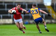 15 June 2025; Sam Mulroy of Louth is tackled by Emmet McMahon of Clare during the GAA Football All-Ireland Senior Championship Round 3 match between Louth and Clare at Laois Hire O'Moore Park in Portlaoise, Laois. Photo by Shauna Clinton/Sportsfile