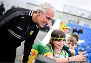 15 June 2025; Donegal manager Jim McGuinness takes a selfie with Donegal supporter Emma McCabe, from Glenties, Donegal, before the GAA Football All-Ireland Senior Championship Round 3 match between Donegal and Mayo at King & Moffatt Dr Hyde Park in Roscommon. Photo by Seb Daly/Sportsfile
