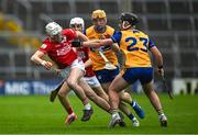 15 June 2025; Adam Dunlea of Cork in action against Eoin O'Connor of Clare during the Electric Ireland GAA Hurling All-Ireland Minor Championship semi-final match between Cork and Clare at FBD Semple Stadium in Thurles, Tipperary. Photo by Brendan Moran/Sportsfile