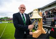 15 June 2025; Former Ireland international Peter Gillespie rings the Roy Torrens bell before match three of the T20 International Series between Ireland and the West Indies at Bready Cricket Club in Magheramason, Tyrone. Photo by Ramsey Cardy/Sportsfile