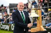 15 June 2025; Former Ireland international Peter Gillespie rings the Roy Torrens bell before match three of the T20 International Series between Ireland and the West Indies at Bready Cricket Club in Magheramason, Tyrone. Photo by Ramsey Cardy/Sportsfile