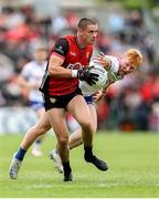 15 June 2025; Pat Havern of Down in action against Ryan O'Toole of Monaghan during the GAA Football All-Ireland Senior Championship Round 3 match between Monaghan and Down at BOX-IT Athletic Grounds in Armagh. Photo by Thomas Flinkow/Sportsfile