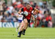 15 June 2025; Pat Havern of Down in action against Ryan O'Toole of Monaghan during the GAA Football All-Ireland Senior Championship Round 3 match between Monaghan and Down at BOX-IT Athletic Grounds in Armagh. Photo by Thomas Flinkow/Sportsfile
