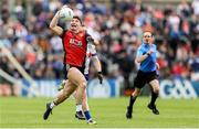 15 June 2025; Daniel Guinness of Down in action against Ryan McAnespie of Monaghan during the GAA Football All-Ireland Senior Championship Round 3 match between Monaghan and Down at BOX-IT Athletic Grounds in Armagh. Photo by Thomas Flinkow/Sportsfile