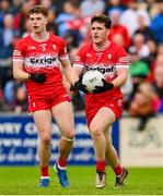 14 June 2025; Padraig McGrogan, right, and Eoin McEvoy of Derry during the GAA Football All-Ireland Senior Championship Round 3 match between Dublin and Derry at Páirc Esler in Newry, Down. Photo by Ramsey Cardy/Sportsfile