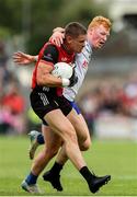 15 June 2025; Pat Havern of Down is tackled by Ryan O'Toole of Monaghan during the GAA Football All-Ireland Senior Championship Round 3 match between Monaghan and Down at BOX-IT Athletic Grounds in Armagh. Photo by Thomas Flinkow/Sportsfile