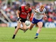 15 June 2025; Pat Havern of Down in action against Ryan O'Toole of Monaghan during the GAA Football All-Ireland Senior Championship Round 3 match between Monaghan and Down at BOX-IT Athletic Grounds in Armagh. Photo by Thomas Flinkow/Sportsfile