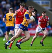 15 June 2025; Emmet McMahon of Clare is tackled by Dara McDonnell of Louth during the GAA Football All-Ireland Senior Championship Round 3 match between Louth and Clare at Laois Hire O'Moore Park in Portlaoise, Laois. Photo by Shauna Clinton/Sportsfile