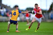 15 June 2025; Ciaran Downey of Louth is tackled by Manus Doherty of Clare during the GAA Football All-Ireland Senior Championship Round 3 match between Louth and Clare at Laois Hire O'Moore Park in Portlaoise, Laois. Photo by Shauna Clinton/Sportsfile
