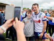 15 June 2025; Ryan Wylie of Monaghan has his photo taken with a supporter after the GAA Football All-Ireland Senior Championship Round 3 match between Monaghan and Down at BOX-IT Athletic Grounds in Armagh. Photo by Thomas Flinkow/Sportsfile