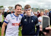 15 June 2025; Ryan Wylie of Monaghan has his photo taken with a supporter after the GAA Football All-Ireland Senior Championship Round 3 match between Monaghan and Down at BOX-IT Athletic Grounds in Armagh. Photo by Thomas Flinkow/Sportsfile