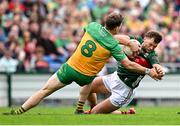 15 June 2025; Aidan O’Shea of Mayo in action against Hugh McFadden of Donegal during the GAA Football All-Ireland Senior Championship Round 3 match between Donegal and Mayo at King & Moffatt Dr Hyde Park in Roscommon. Photo by Seb Daly/Sportsfile